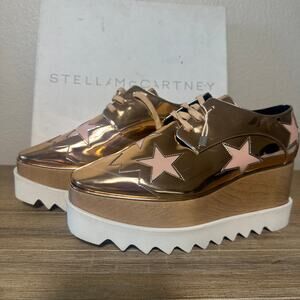 Stella McCartney Metallic Gold Platform Lace-Up Oxfords with Pink Star Appliqués